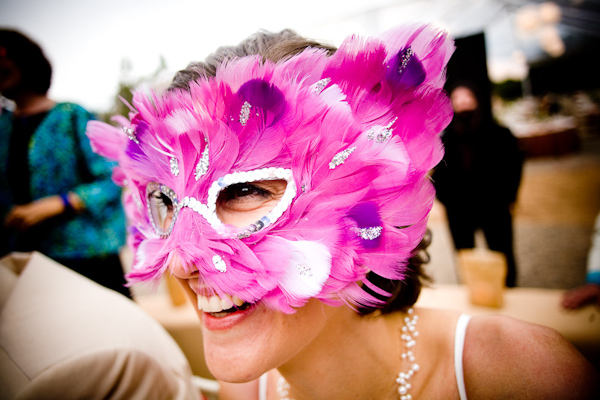 bride wearing a fun purple feathered mask with sequins - photo by New Mexico based wedding photographers Twin Lens